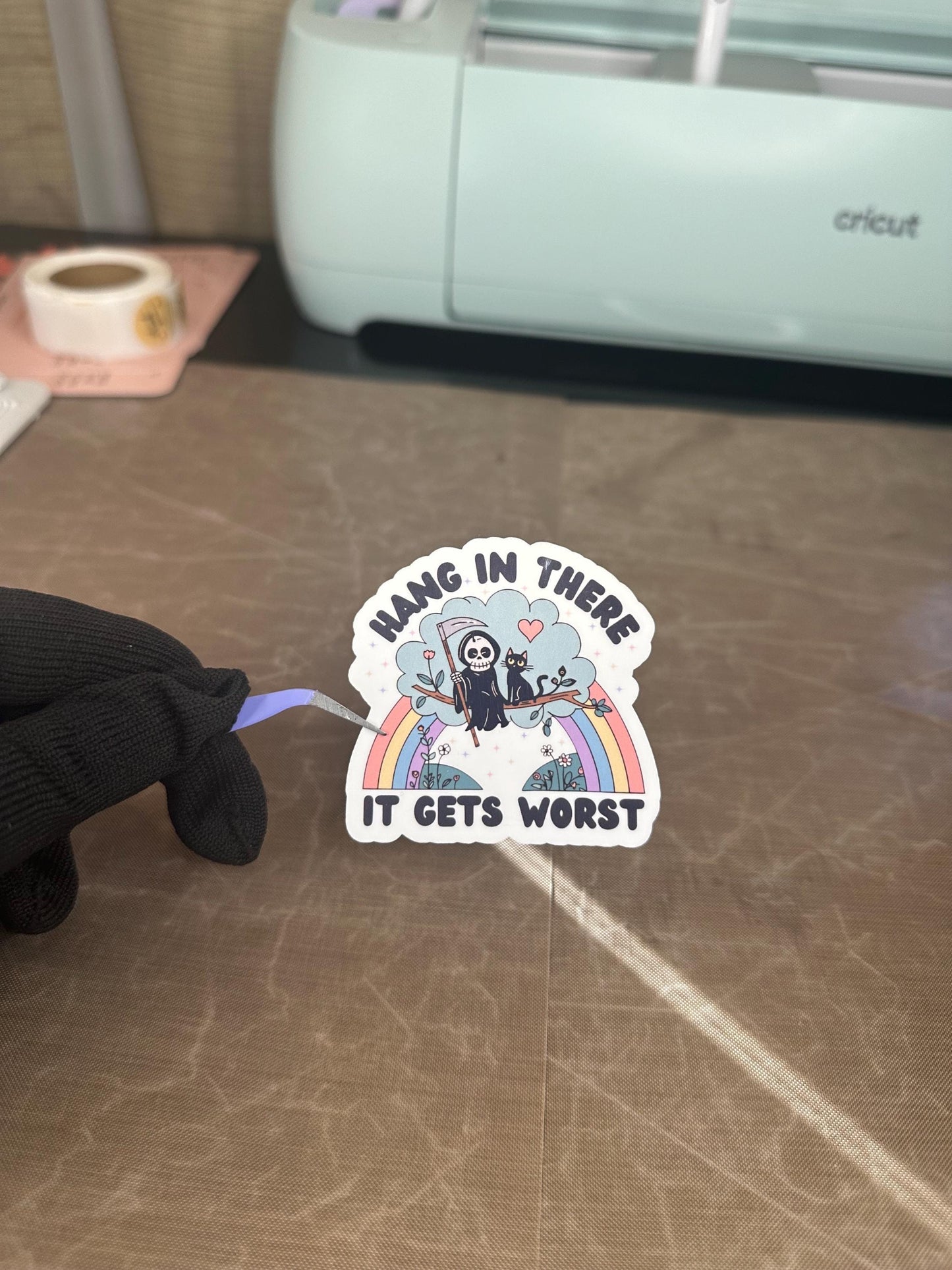Hang In There It Gets Worse Funny Grumpy Reaper Unicorn Sticker | Dark Humor Gift